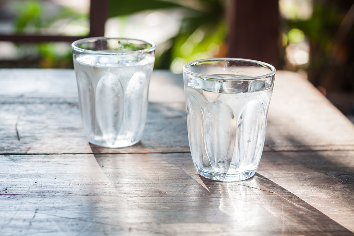 two glasses of water on a table