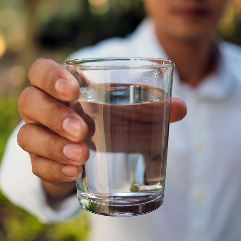 Man holding glass of water